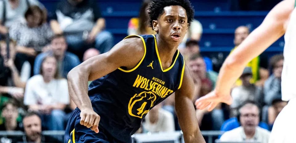 Player in Michigan Wolverines jersey during basketball game