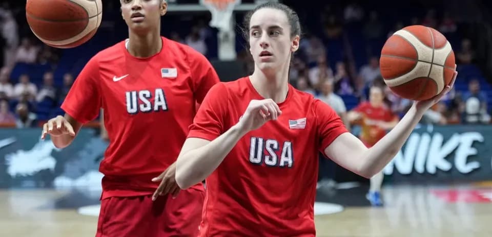 Two players warming up with basketballs in USA jerseys