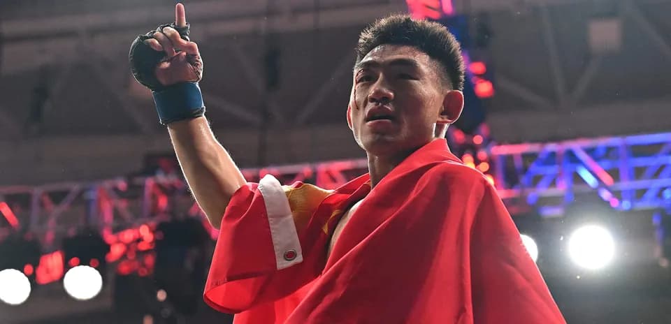Boxer celebrating victory with a flag raised