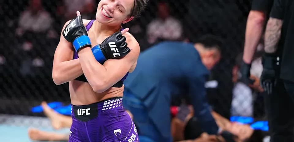Fighter celebrating victory in UFC octagon