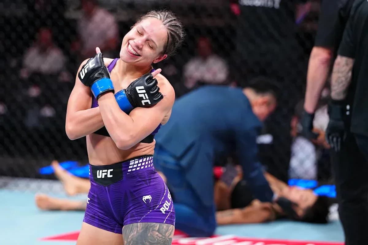 Fighter celebrating victory in UFC octagon