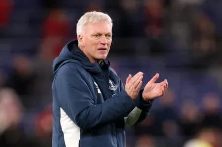 Manager applauding fans during match at stadium