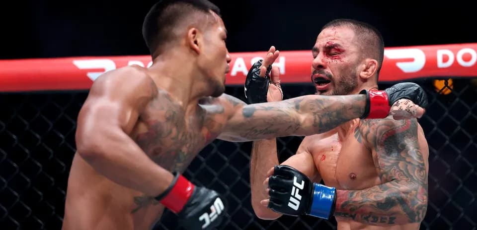 Fighter landing a punch during MMA match