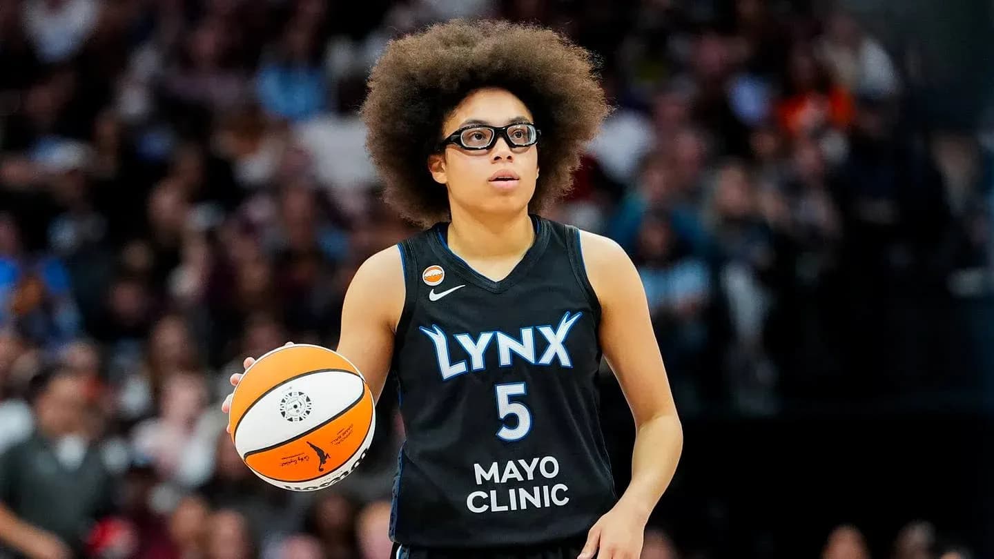 Player dribbling basketball during game for Lynx