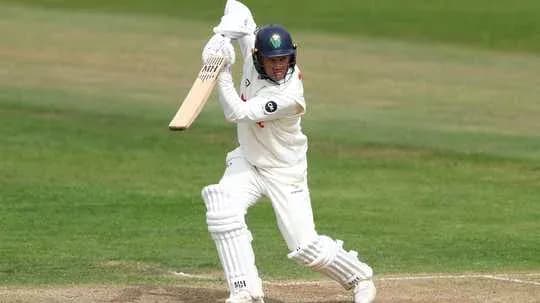 Batsman playing a shot during cricket match