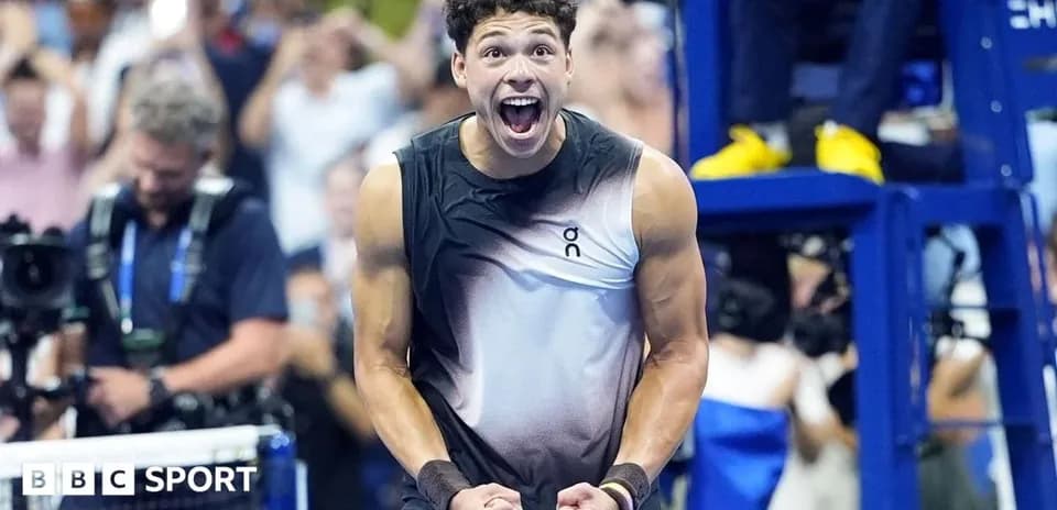 Tennis player celebrating victory during match