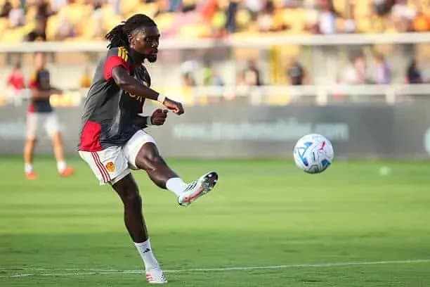 Player kicking ball during training session on field