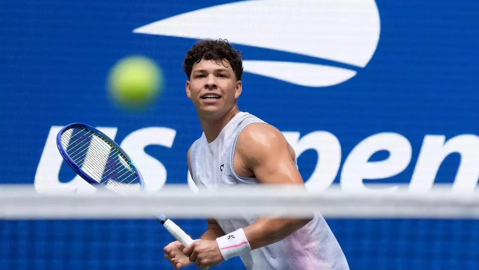 Tennis player preparing to hit a ball at US Open
