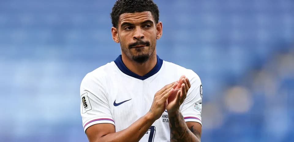 Player applauding fans after a match