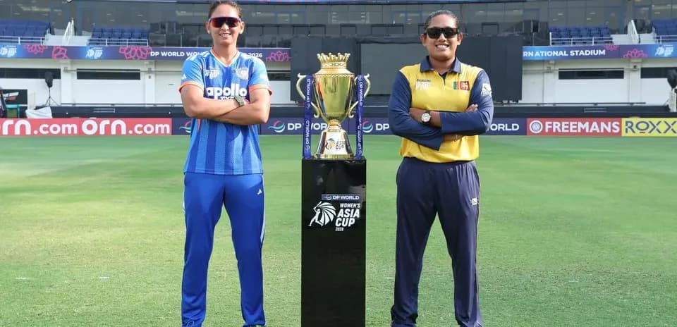 Two cricket captains with the Women's Asia Cup trophy