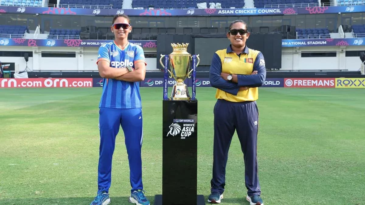 Two cricket captains with the Women's Asia Cup trophy