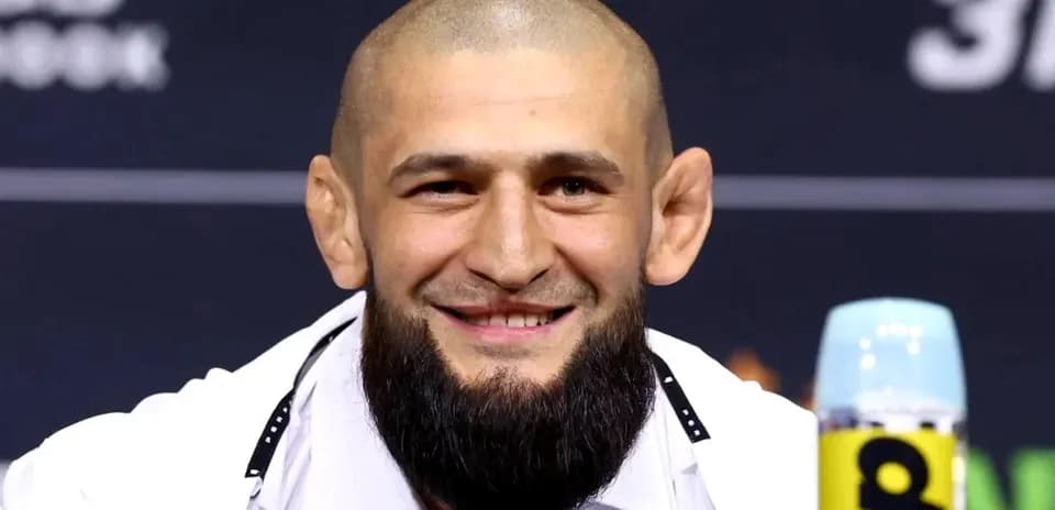 Fighter smiling during press conference appearance