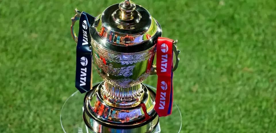 Trophy with ribbons displayed on a glass stand