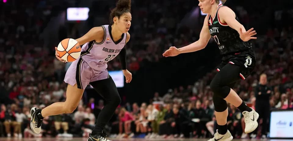 Player dribbling ball during basketball game action