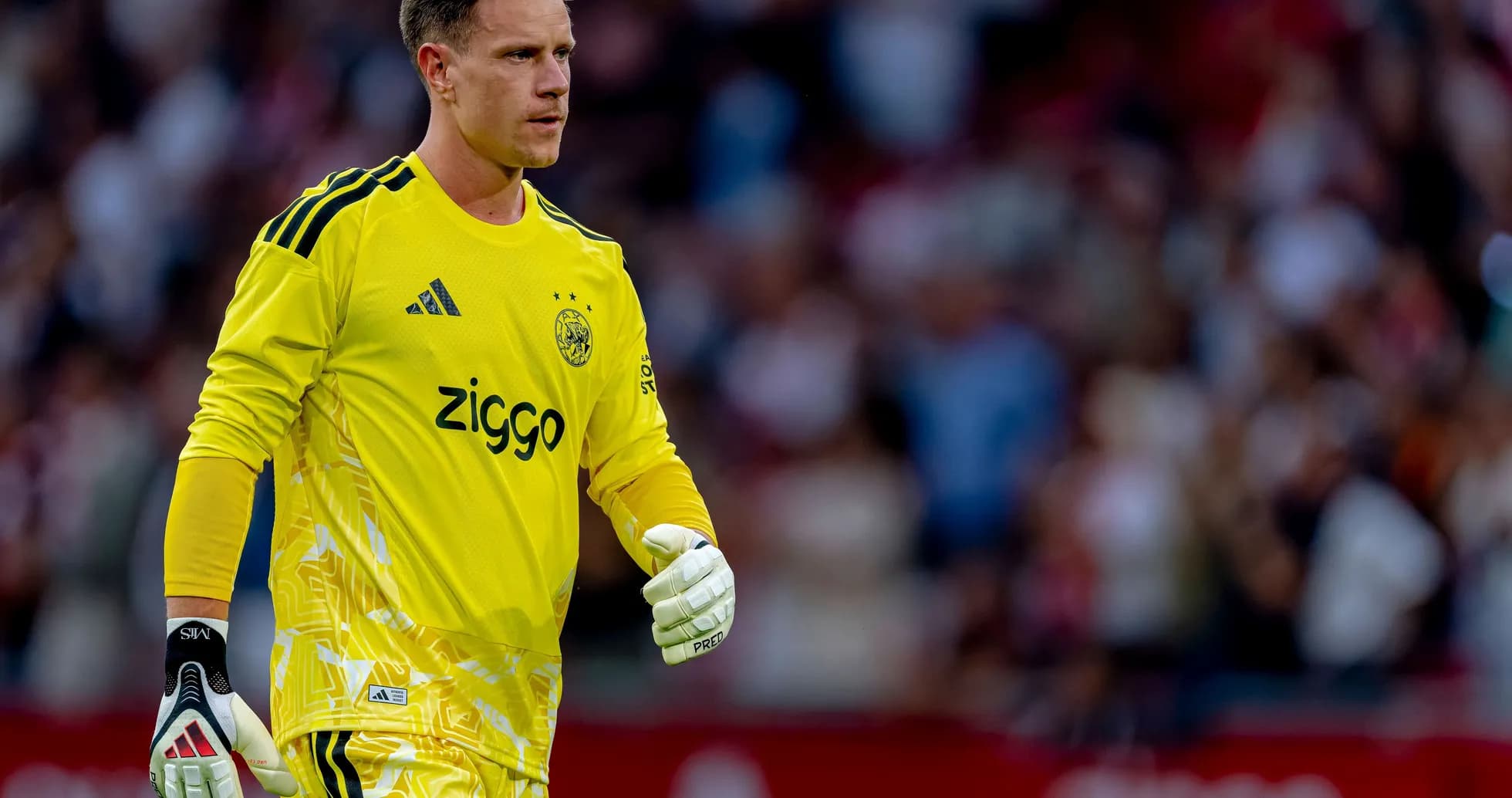 Goalkeeper wearing yellow kit during match