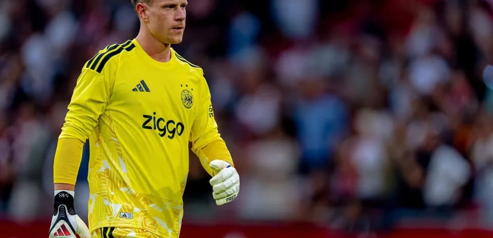 Goalkeeper wearing yellow kit during match
