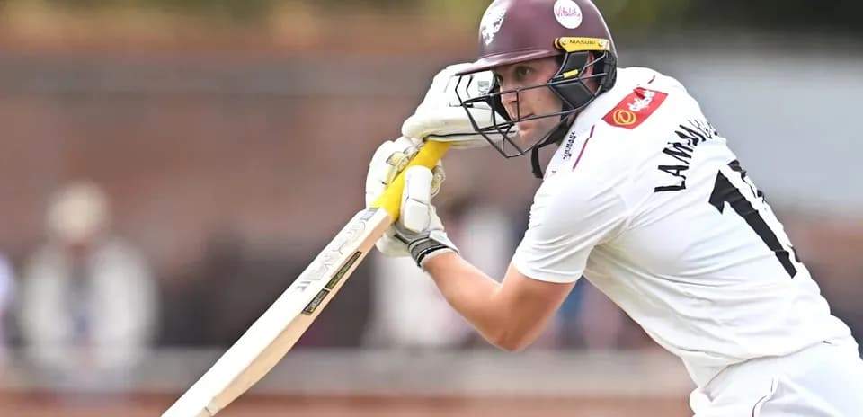 Batsman playing a shot during a cricket match