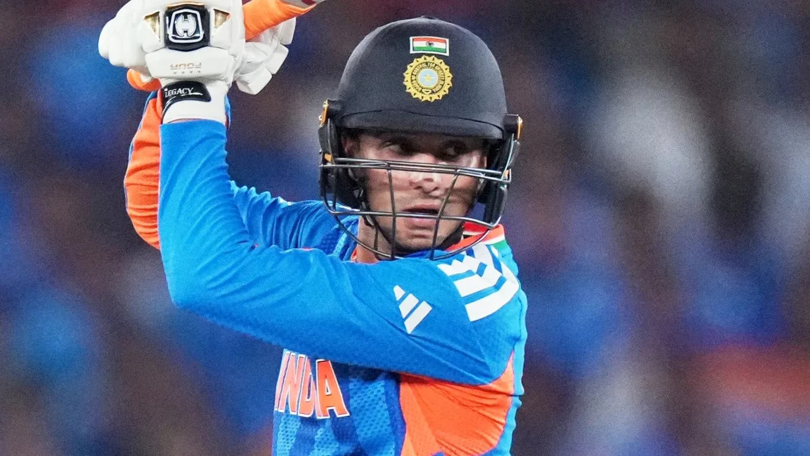 Batter preparing to strike during cricket match