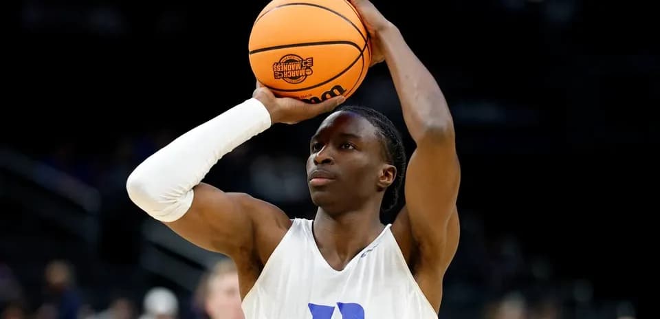 Player preparing to shoot basketball during warm-up