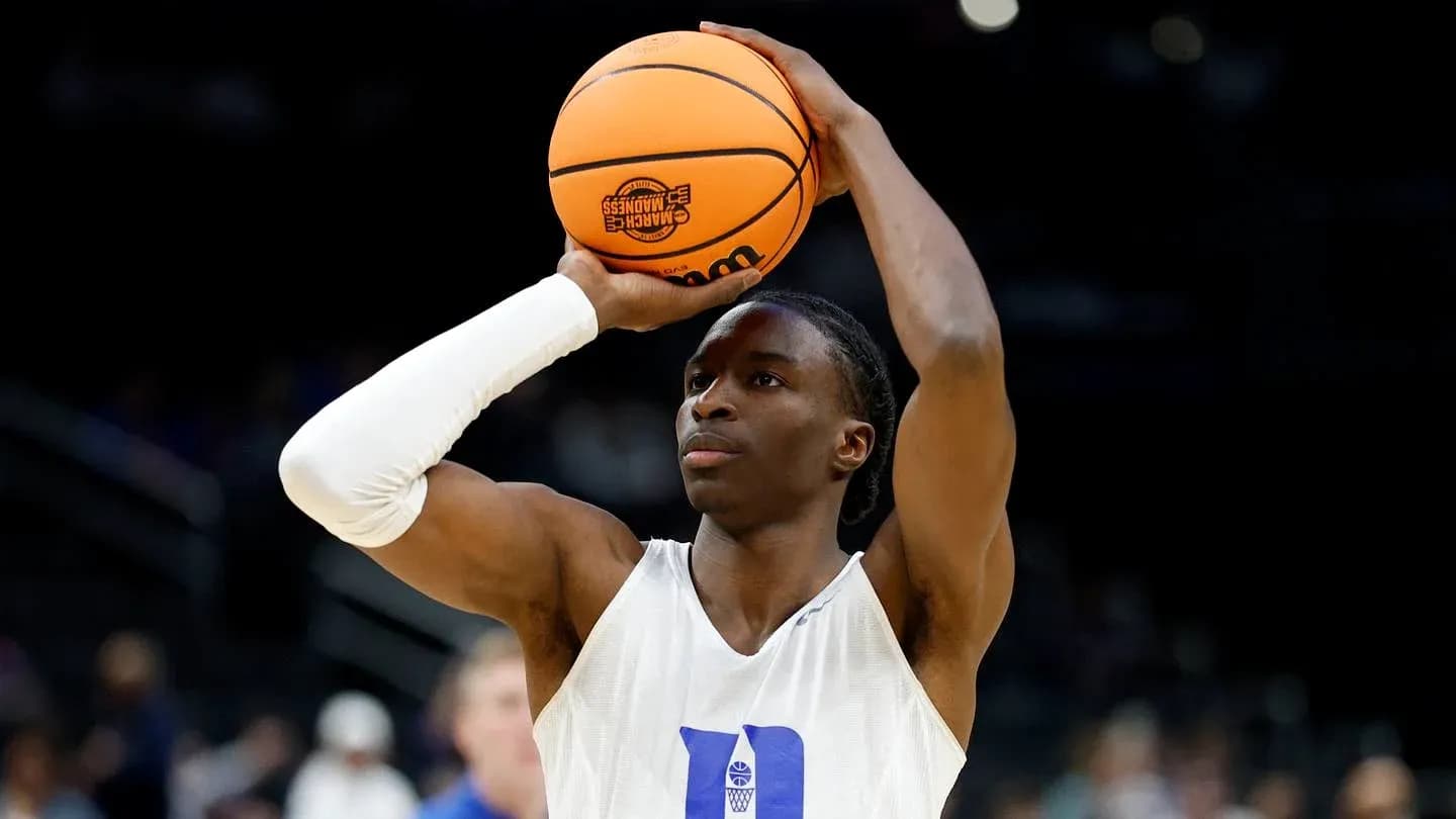 Player preparing to shoot basketball during warm-up