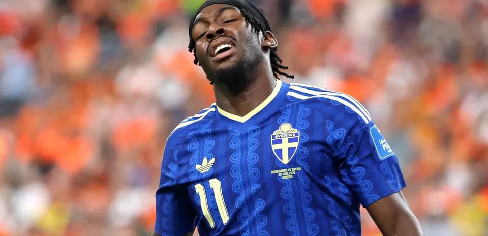 Player in blue Sweden jersey during match
