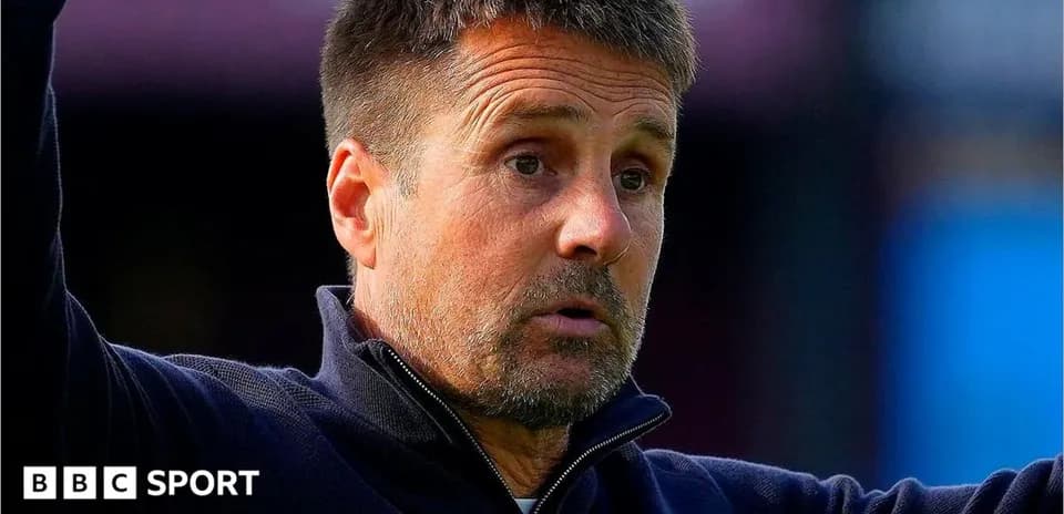 Coach gesturing during a match on the sidelines
