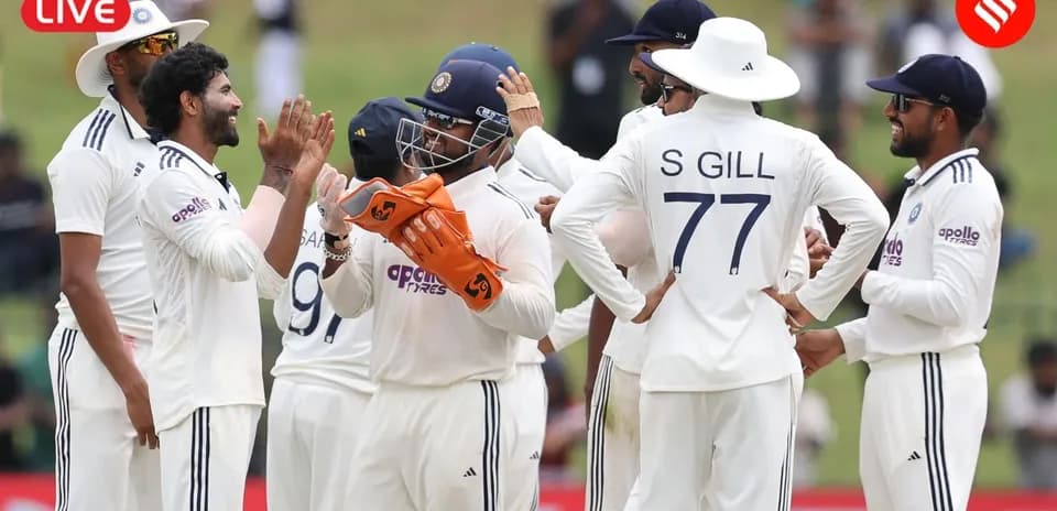 Indian cricket team celebrating a wicket on field