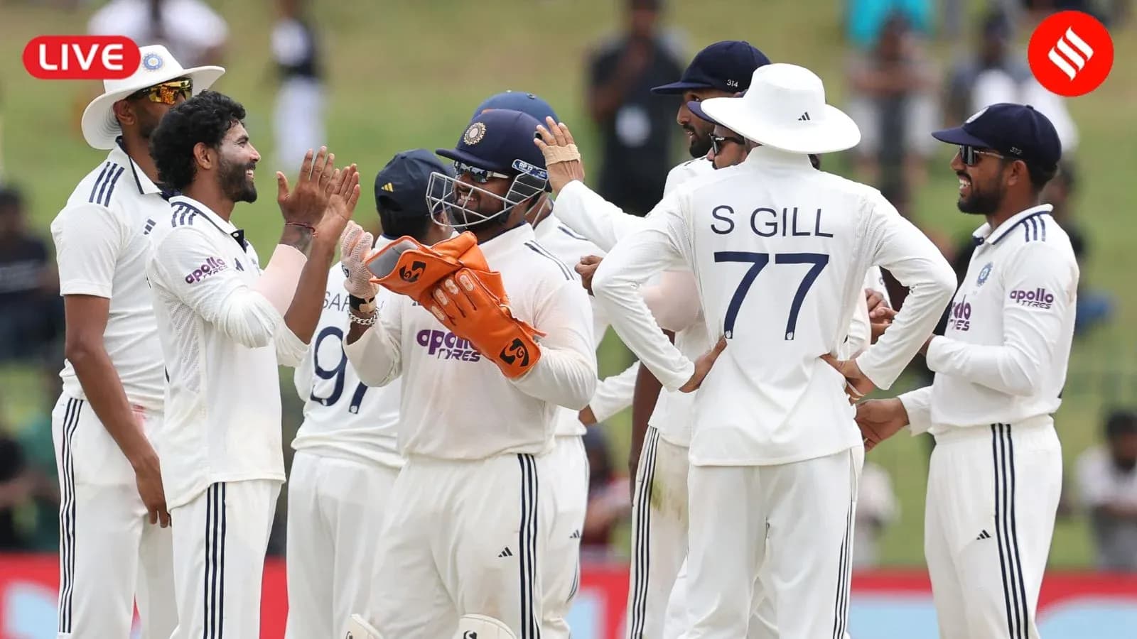 Indian cricket team celebrating a wicket on field