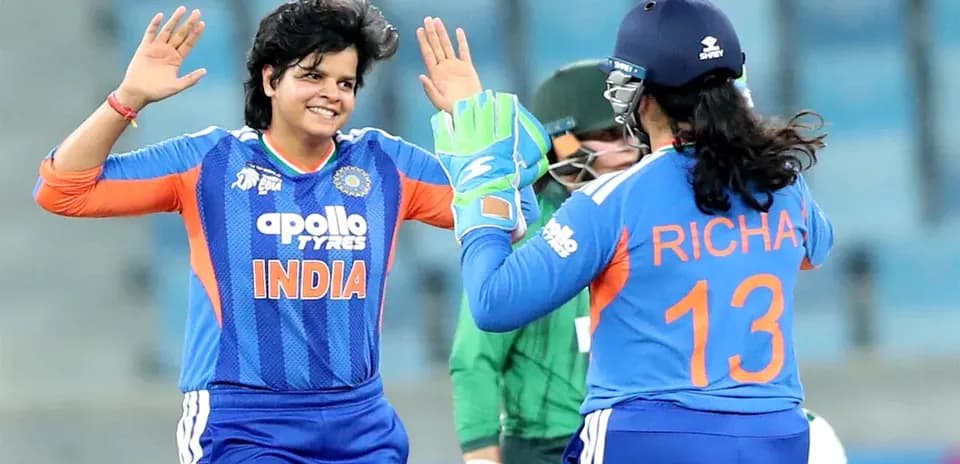 Indian cricketers celebrating a wicket during match