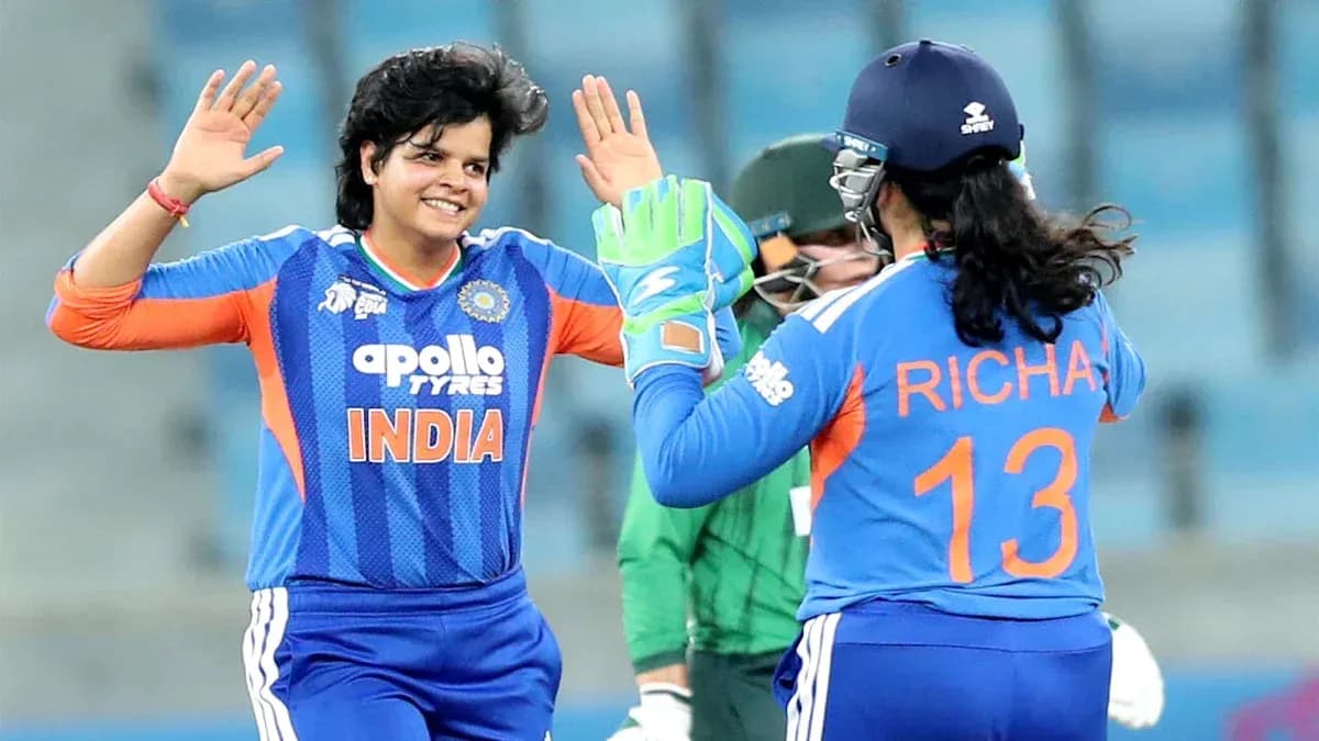 Indian cricketers celebrating a wicket during match