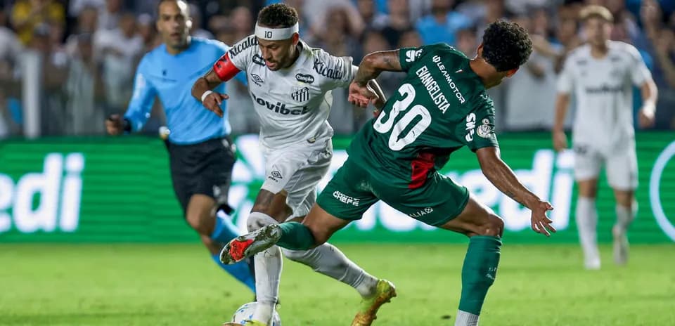 Player in white dribbling past defender in green
