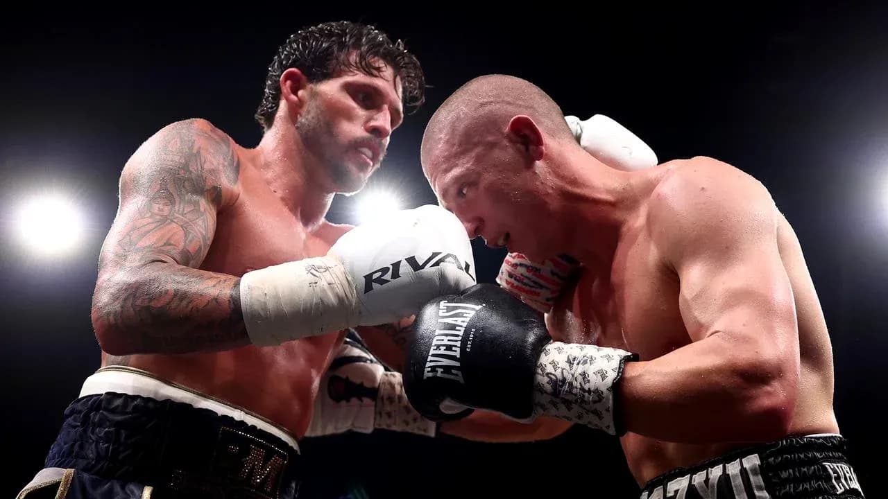 Two boxers engaged in a close fight