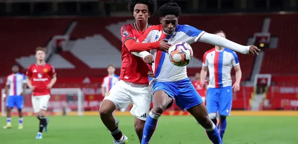 Two players competing for the ball during match