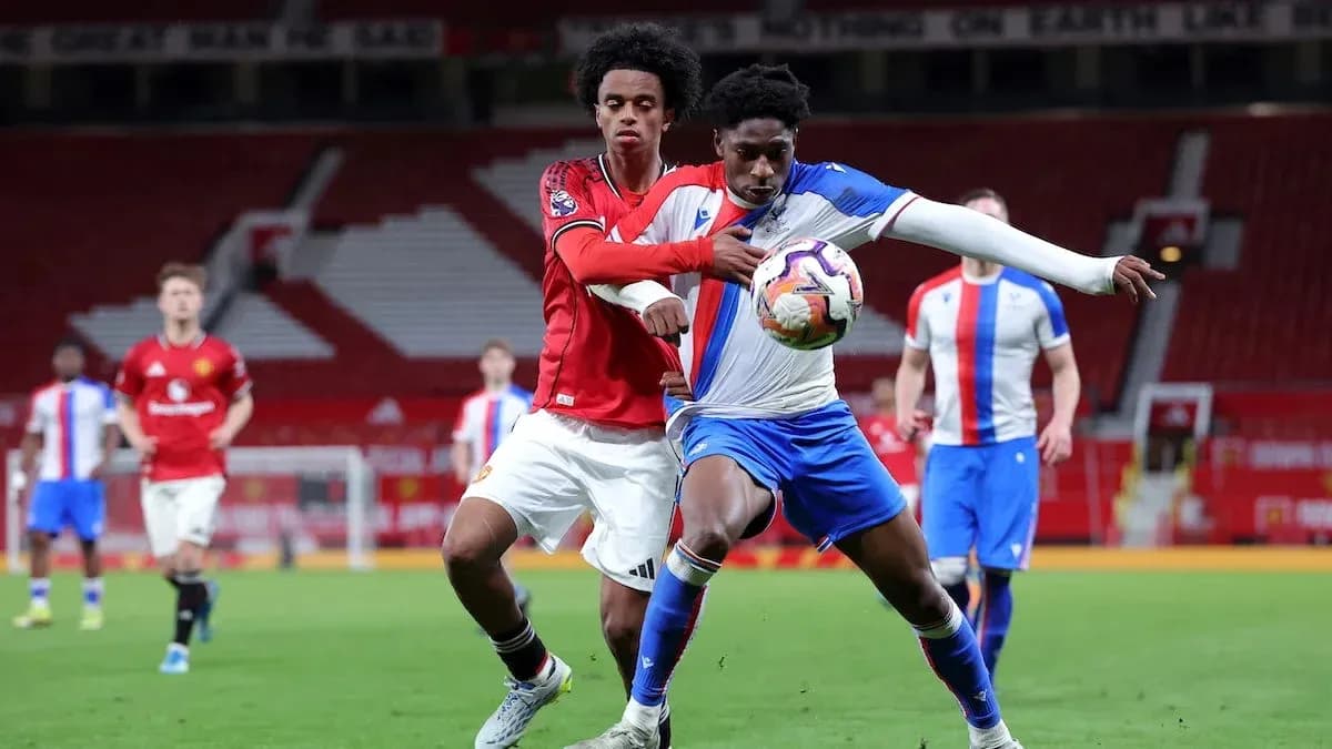 Two players competing for the ball during match
