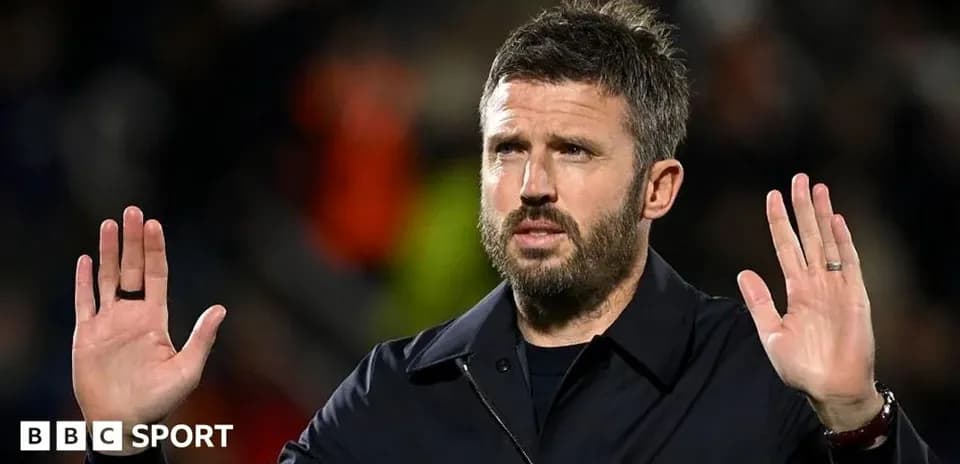 Manager gesturing during a match on the sidelines