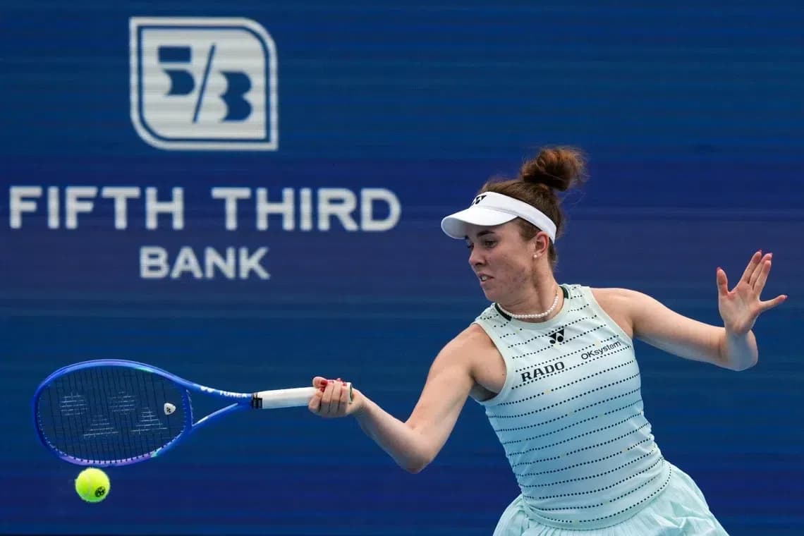 Tennis player hitting a forehand during match