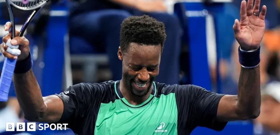 Tennis player celebrating victory with raised hands