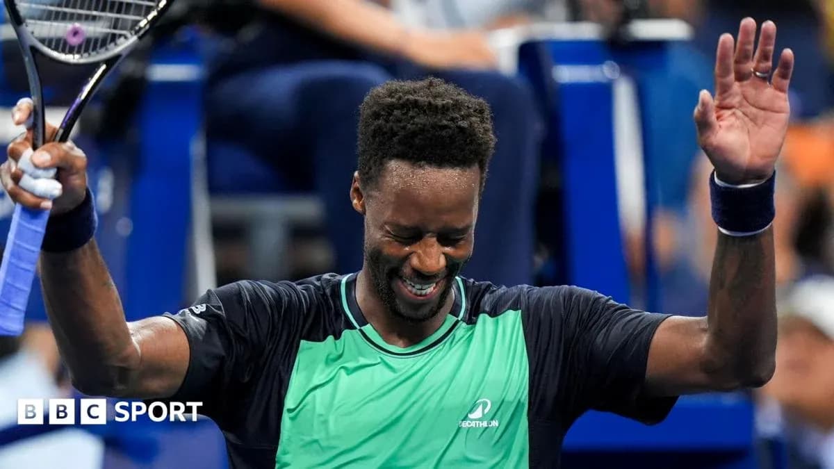 Tennis player celebrating victory with raised hands