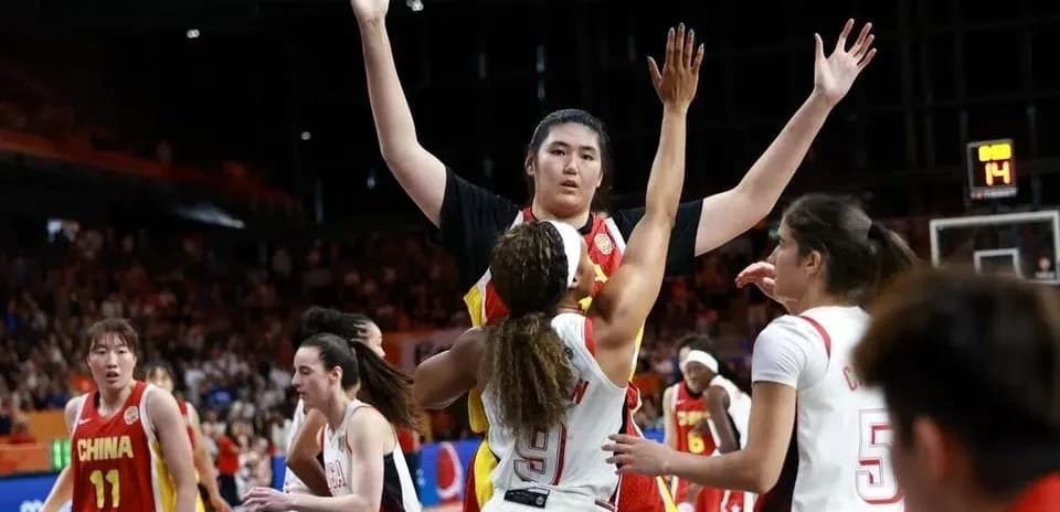 Players contesting during basketball game action