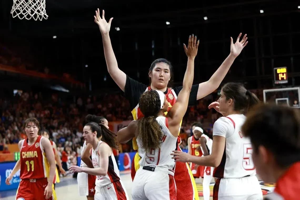 Players contesting during basketball game action