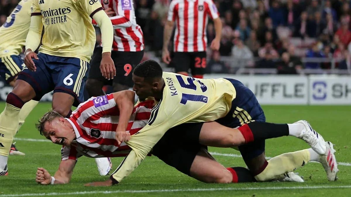 Players battling for the ball on the ground