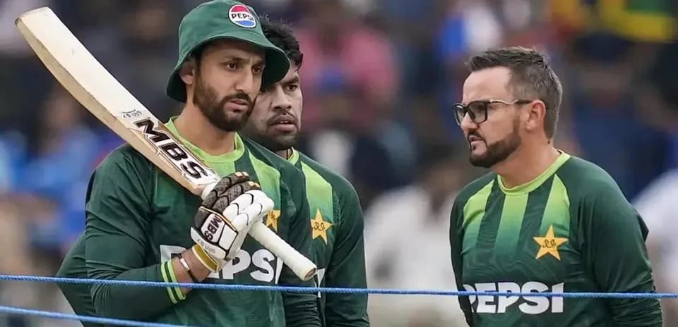 Pakistani cricketers discussing strategy during practice