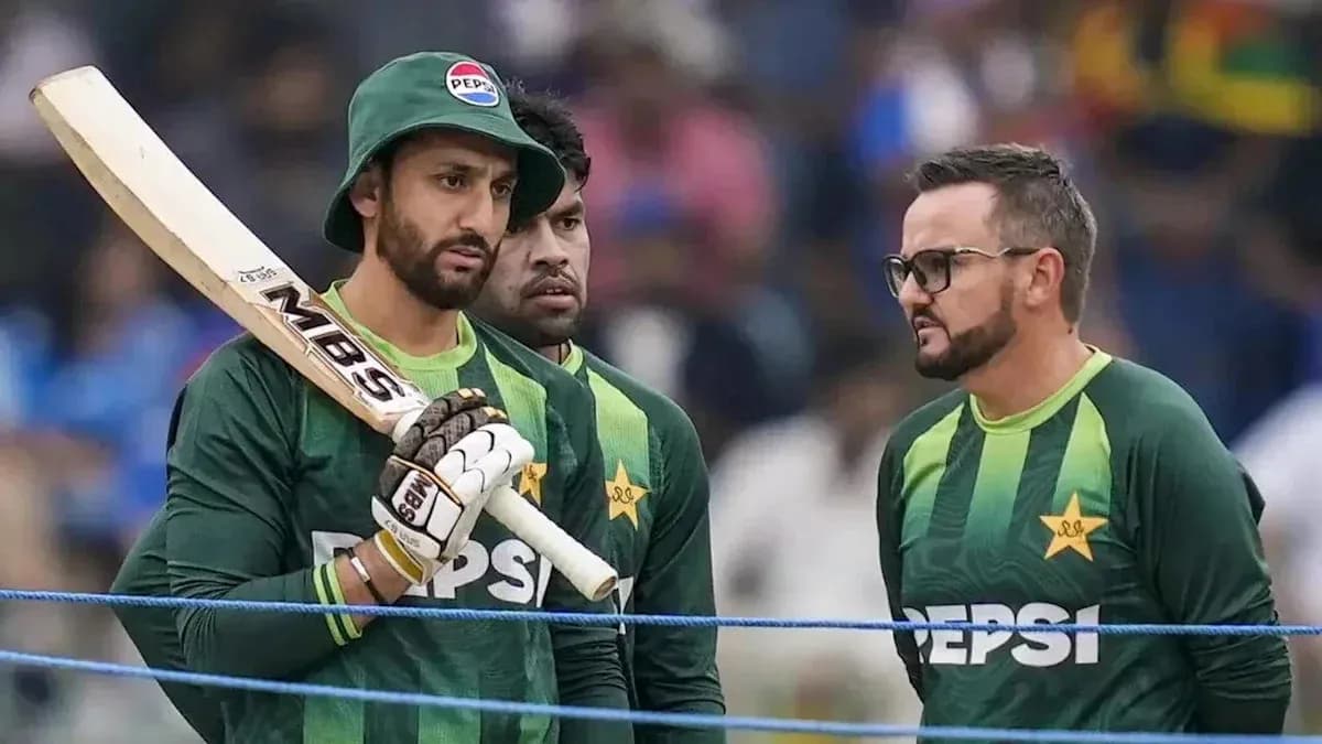 Pakistani cricketers discussing strategy during practice