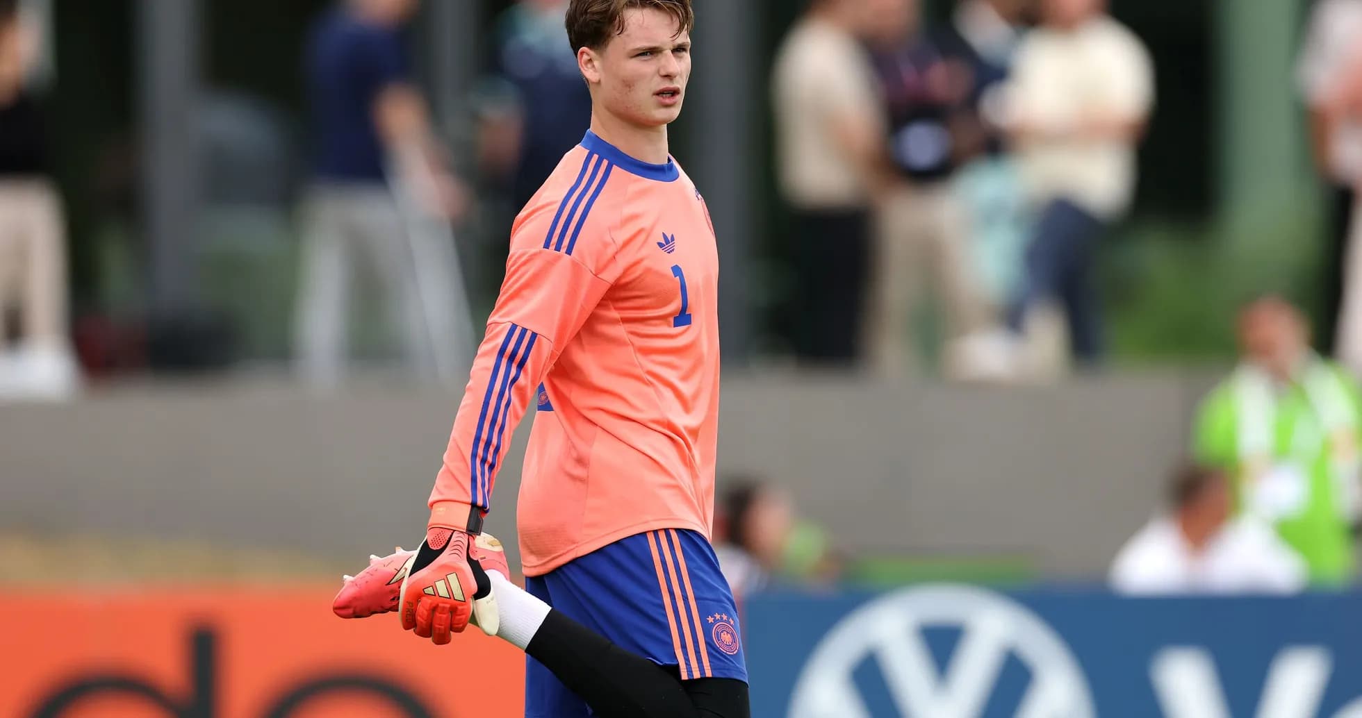 Goalkeeper stretching during training session