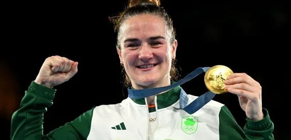 Athlete celebrating with gold medal after victory