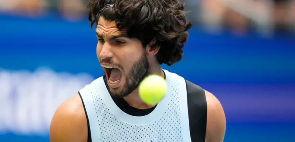 Tennis player reacting as ball approaches during match