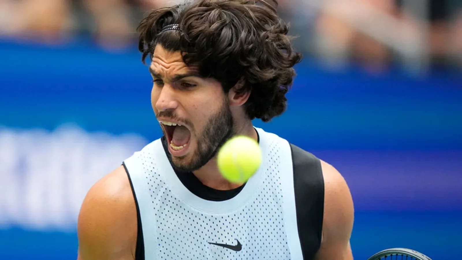 Tennis player reacting as ball approaches during match