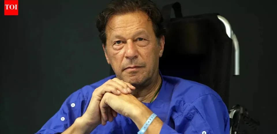 Man in wheelchair wearing blue shirt, serious expression