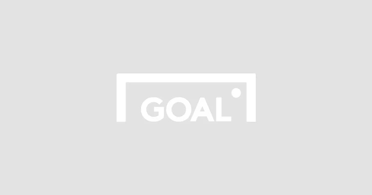 Empty soccer goal with 'GOAL' sign displayed