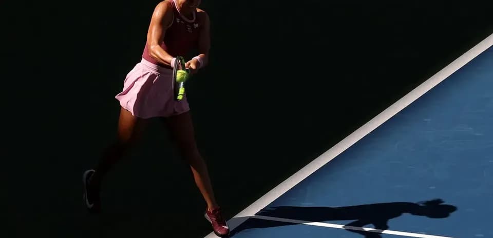 Tennis player hitting a shot on the court